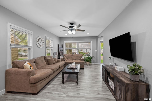 living area featuring recessed lighting, baseboards, a ceiling fan, and light wood-type flooring