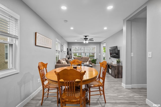 dining area with baseboards, ceiling fan, light wood finished floors, and recessed lighting