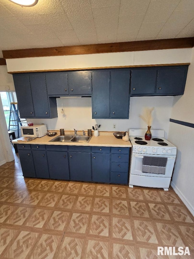 818 16th Ave, Fulton, IL 61252 - kitchen with a sink, blue cabinets, light floors, and white appliances
