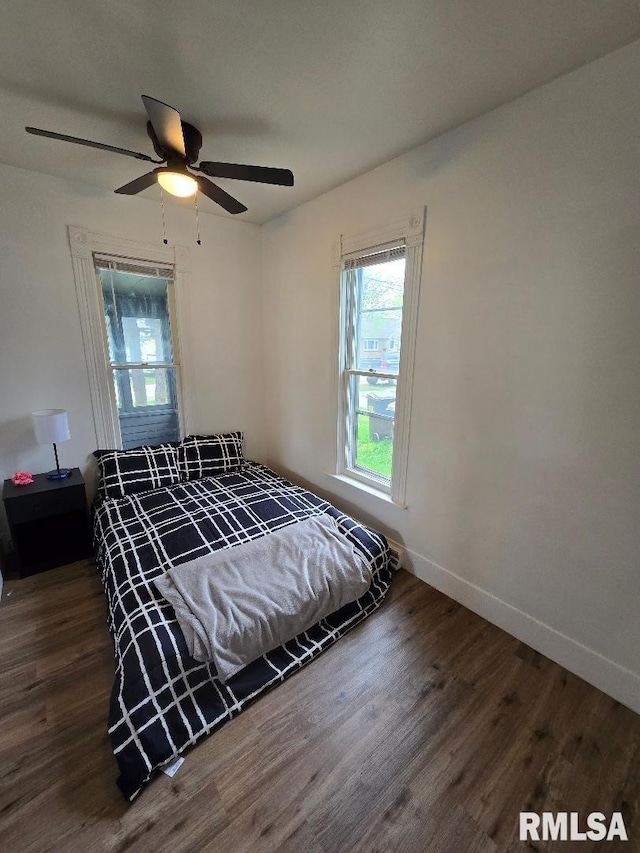 818 16th Ave, Fulton, IL 61252 - bedroom featuring baseboards, a ceiling fan, and wood finished floors