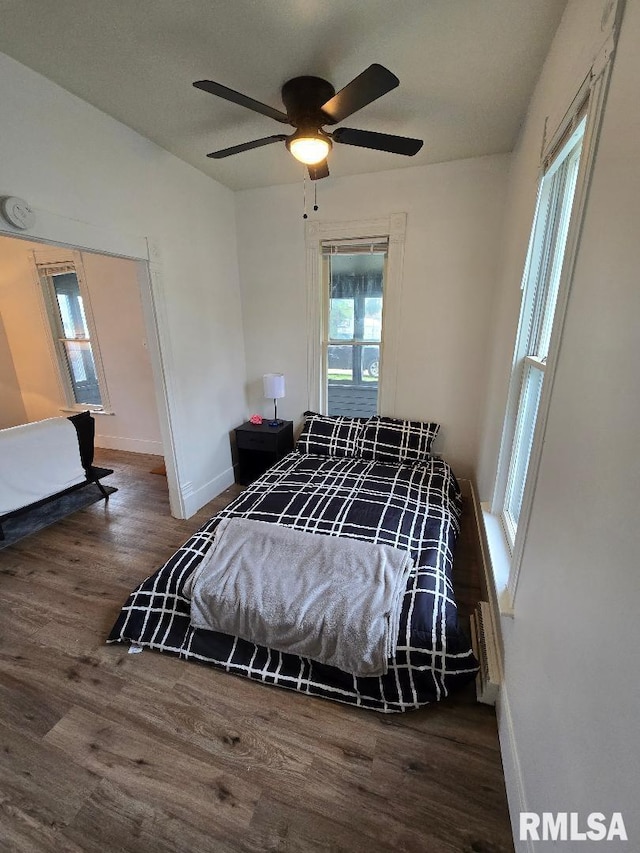 818 16th Ave, Fulton, IL 61252 - bedroom with a ceiling fan, baseboards, and wood finished floors