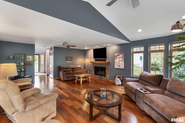 living area featuring wood finished floors, a fireplace, recessed lighting, a ceiling fan, and vaulted ceiling