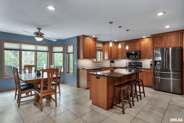 kitchen with stainless steel appliances and brown cabinets