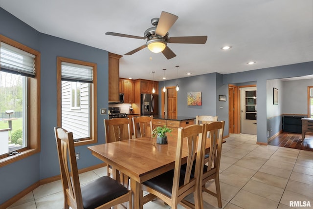 dining room with baseboards, recessed lighting, ceiling fan, and light tile patterned flooring