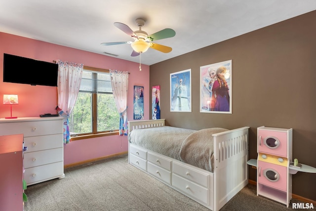 carpeted bedroom featuring baseboards, ceiling fan, and visible vents