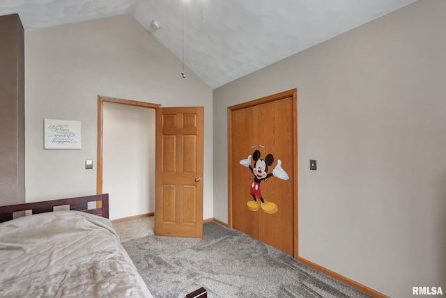 unfurnished bedroom with carpet flooring, baseboards, and high vaulted ceiling