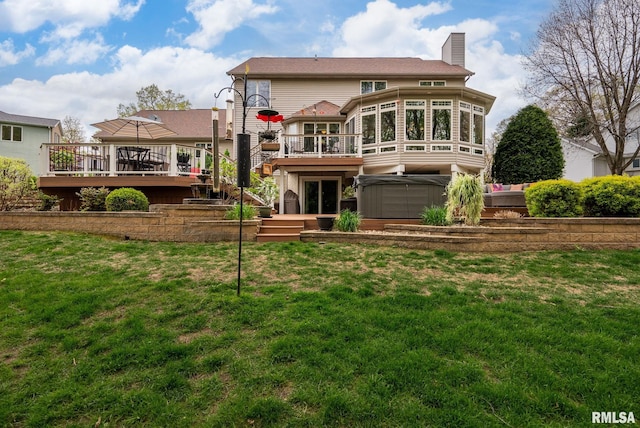 rear view of house with a wooden deck, a chimney, stairs, a hot tub, and a yard