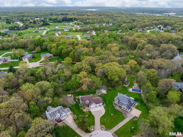 aerial view with a residential view and a wooded view