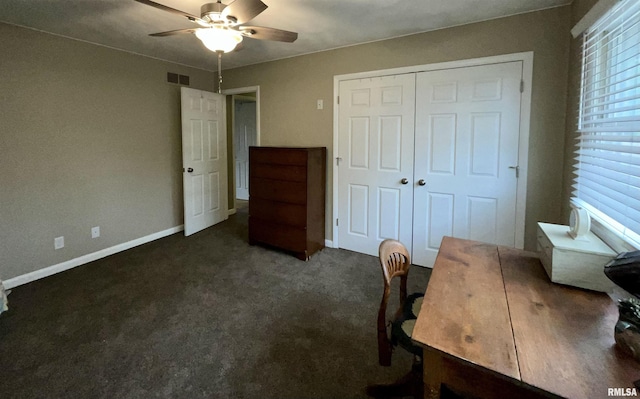 office area featuring carpet flooring, a ceiling fan, baseboards, and visible vents