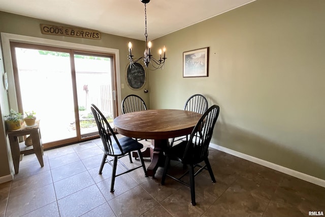 dining room featuring baseboards, a notable chandelier, and tile patterned flooring