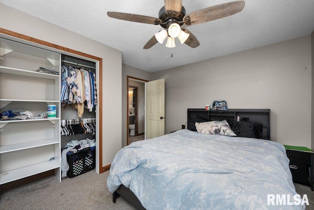 carpeted bedroom featuring a ceiling fan, baseboards, and a closet