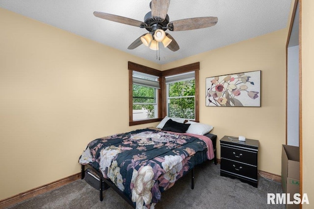 carpeted bedroom with baseboards and a ceiling fan