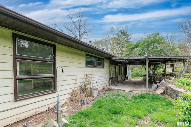 view of property exterior with a patio