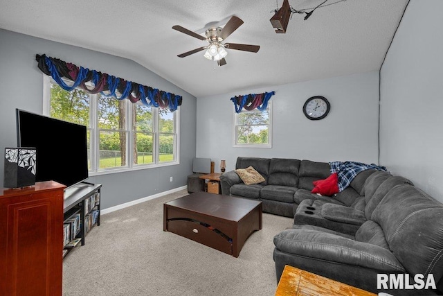 2303 Pinehurst St, Bettendorf, IA 52722 - living area featuring ceiling fan, vaulted ceiling, baseboards, carpet flooring, and a textured ceiling