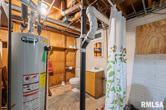 2303 Pinehurst St, Bettendorf, IA 52722 - unfinished basement with water heater and brick wall