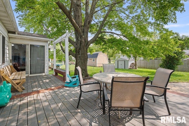 2303 Pinehurst St, Bettendorf, IA 52722 - wooden deck featuring outdoor dining space