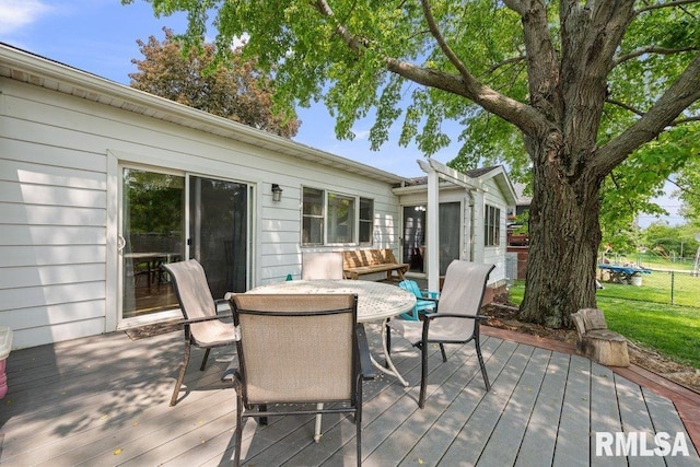 2303 Pinehurst St, Bettendorf, IA 52722 - wooden deck with outdoor dining space