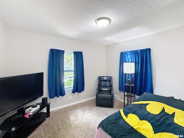 bedroom featuring carpet flooring, a textured ceiling, and baseboards