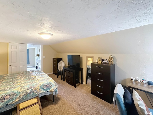 bedroom featuring light colored carpet, a textured ceiling, and lofted ceiling