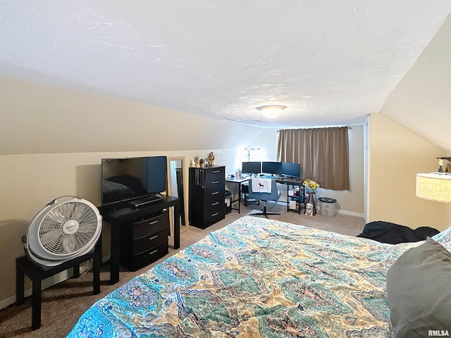 carpeted bedroom featuring vaulted ceiling and baseboards