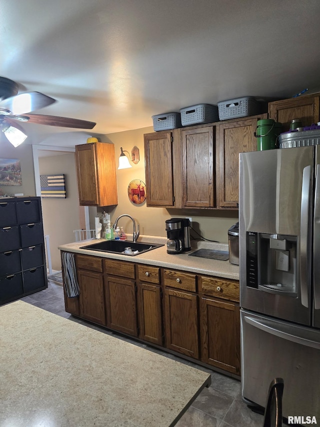 717 NE 2nd St, Galva, IL 61434 - kitchen featuring a ceiling fan, light countertops, a sink, and stainless steel refrigerator with ice dispenser