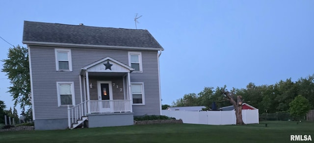 717 NE 2nd St, Galva, IL 61434 - view of front of property featuring fence and a front yard