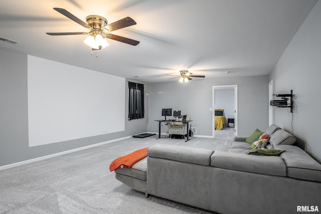 living area featuring carpet flooring, visible vents, baseboards, and ceiling fan