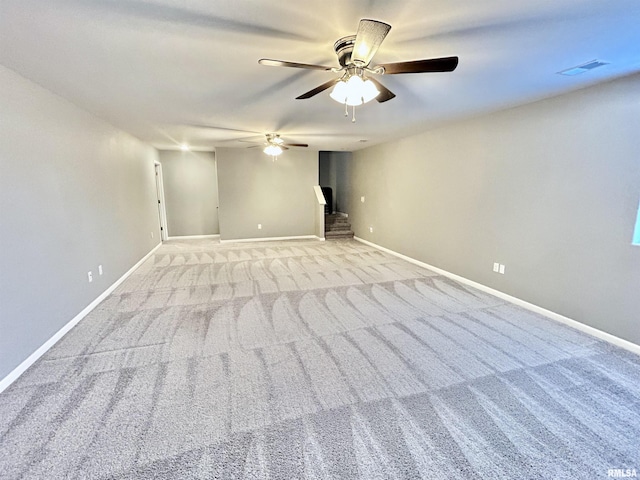 1609 Parkview Ln, Davenport, IA 52807 - unfurnished room with a ceiling fan, light colored carpet, and baseboards