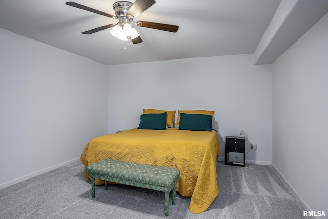 carpeted bedroom featuring ceiling fan and baseboards