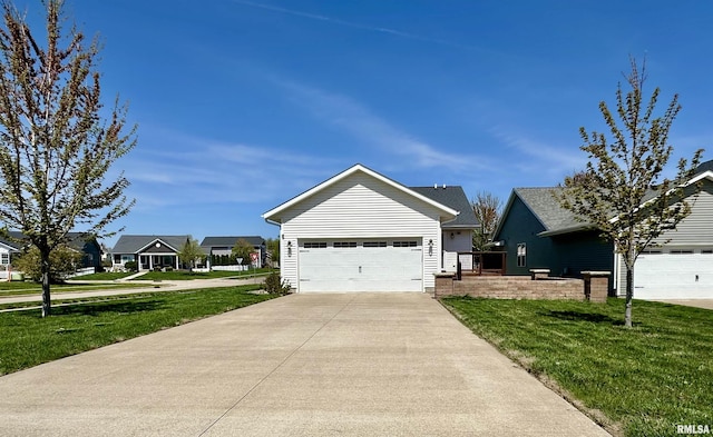 view of front facade with a garage and a front yard