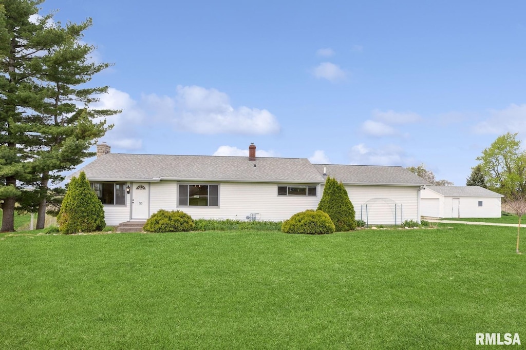 510 N 18th St, Clinton, IA 52732 - rear view of house featuring a chimney and a yard