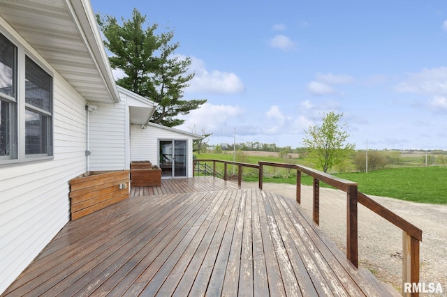 wooden terrace featuring a rural view
