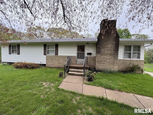 4528 5th St Unit B, East Moline, IL 61244 - ranch-style house featuring a chimney, a front yard, and brick siding