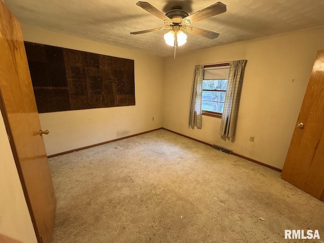 4528 5th St Unit B, East Moline, IL 61244 - spare room featuring carpet floors, a ceiling fan, and baseboards