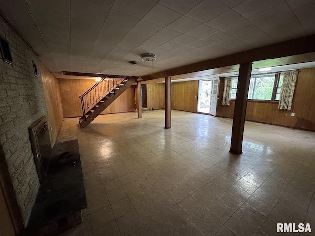 4528 5th St Unit B, East Moline, IL 61244 - below grade area with tile patterned floors, wooden walls, and stairs