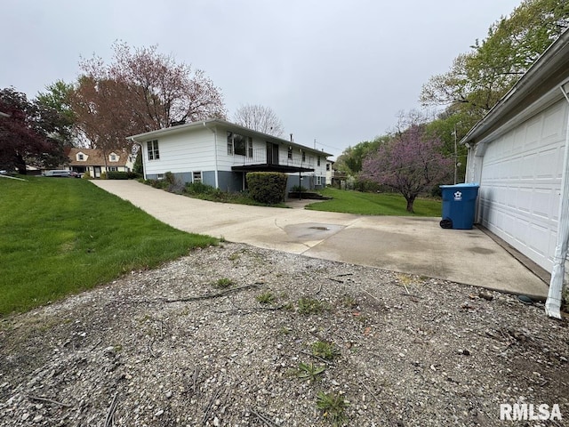 4528 5th St Unit B, East Moline, IL 61244 - view of side of property featuring a lawn and concrete driveway