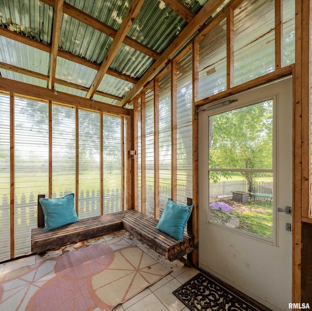 sunroom / solarium with tile patterned flooring
