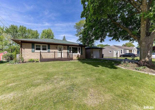 3418 25th St, Rock Island, IL 61201 - ranch-style home featuring driveway, brick siding, a front lawn, and a garage