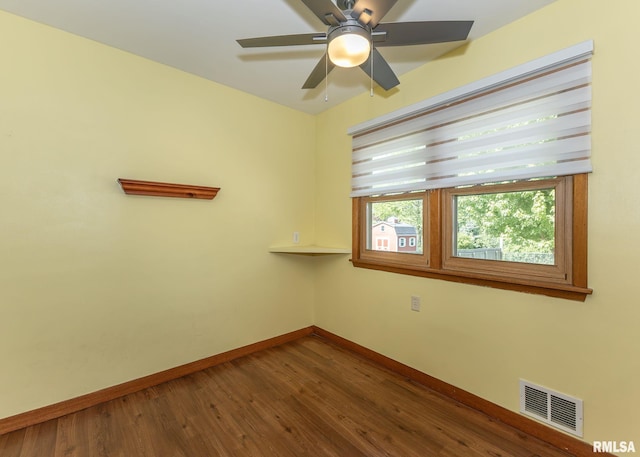 3418 25th St, Rock Island, IL 61201 - unfurnished room featuring baseboards, dark wood-style flooring, and ceiling fan
