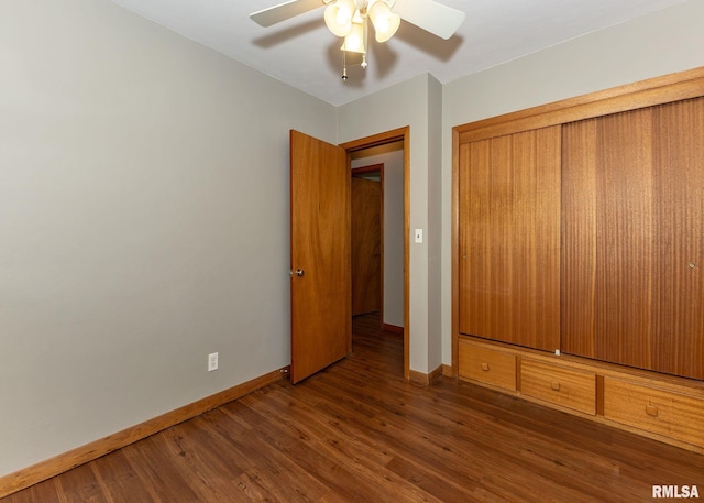 3418 25th St, Rock Island, IL 61201 - unfurnished bedroom featuring baseboards, wood finished floors, a closet, and ceiling fan