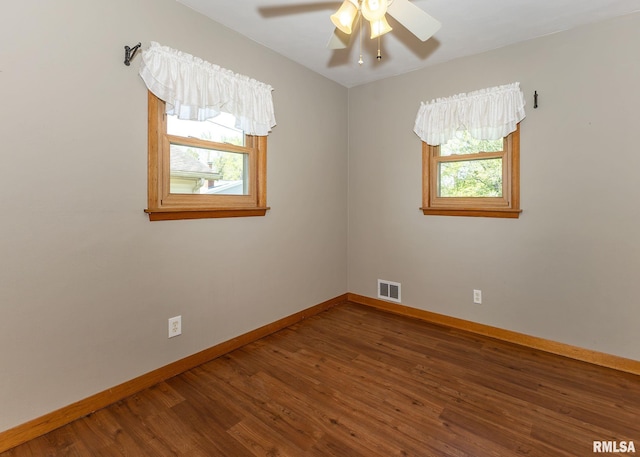 3418 25th St, Rock Island, IL 61201 - unfurnished room with baseboards, wood finished floors, and a ceiling fan