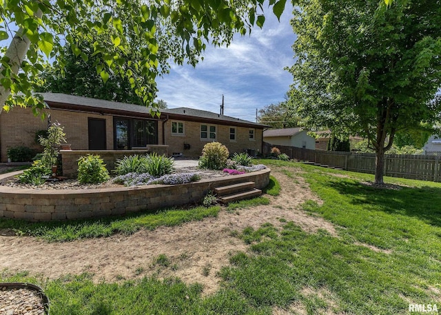 3418 25th St, Rock Island, IL 61201 - back of house featuring brick siding and a patio area
