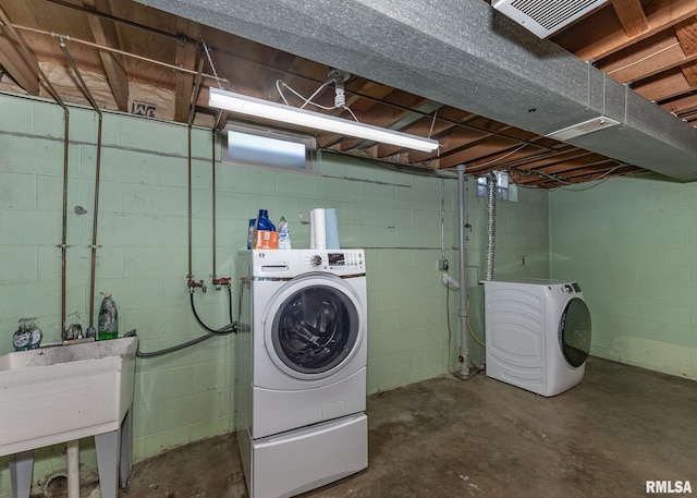 3418 25th St, Rock Island, IL 61201 - clothes washing area with independent washer and dryer
