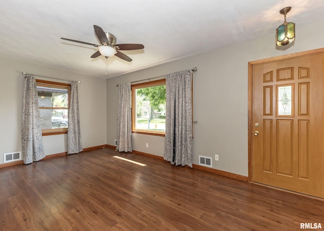 3418 25th St, Rock Island, IL 61201 - entryway with wood finished floors, a ceiling fan, and baseboards