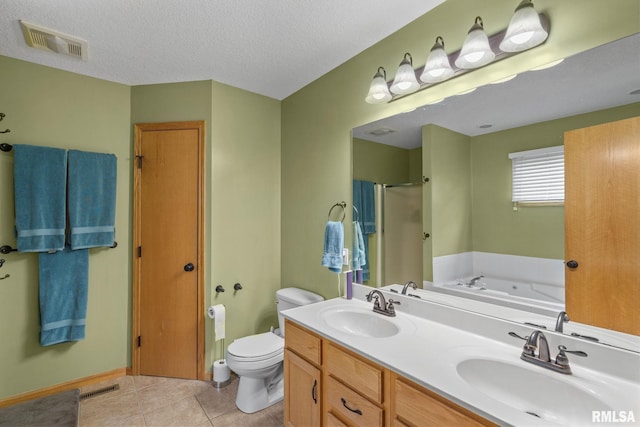 bathroom featuring a stall shower, toilet, visible vents, and a sink