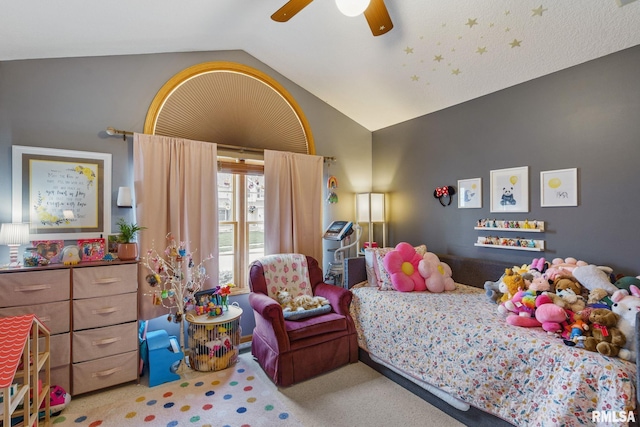bedroom with vaulted ceiling, carpet, and a ceiling fan