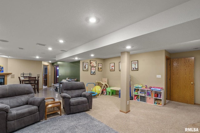 living room with baseboards, carpet flooring, and recessed lighting