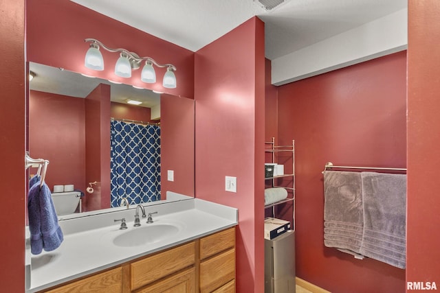 full bathroom featuring curtained shower and vanity