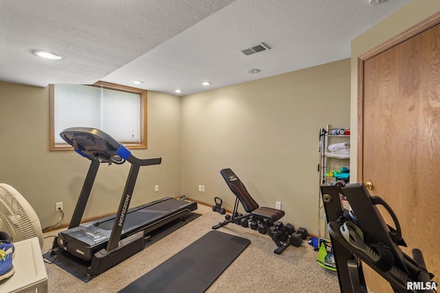 exercise area with a textured ceiling, carpet, visible vents, recessed lighting, and baseboards