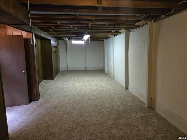 below grade area featuring carpet flooring